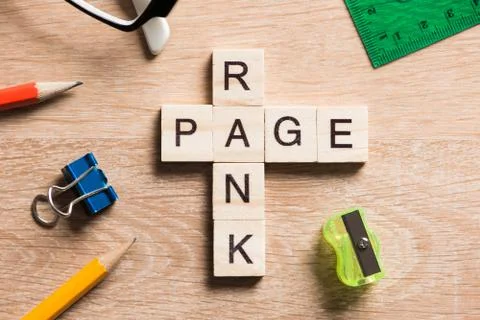 Conceptual media keywords on table with elements of game making crossword Foto stock