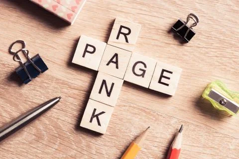 Conceptual media keywords on table with elements of game making crossword Foto stock