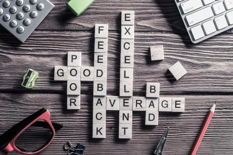 Conceptual media keywords on table with elements of game making crossword Stock Photos