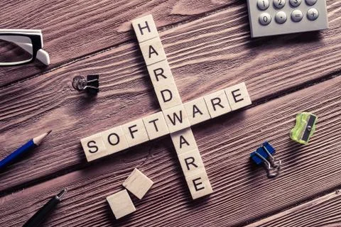 Conceptual media keywords on table with elements of game making crossword Stock Photos