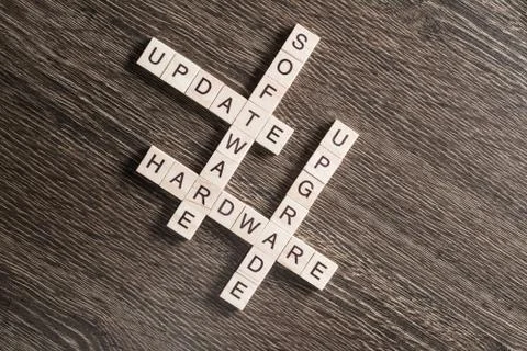 Conceptual media keywords on table with elements of game making crossword Stock Photos