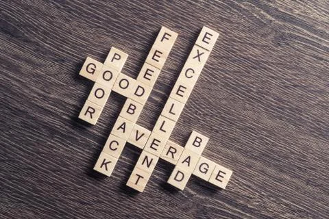 Conceptual media keywords on table with elements of game making crossword Foto stock