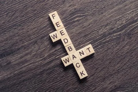 Conceptual media keywords on table with elements of game making crossword Foto stock