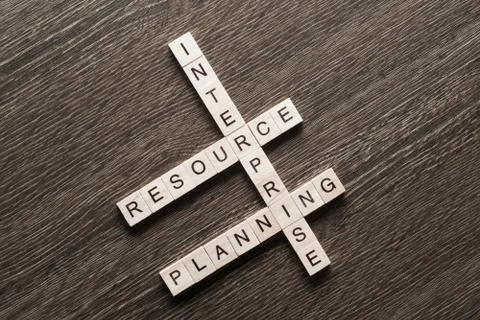 Conceptual media keywords on table with elements of game making crossword Stock Photos