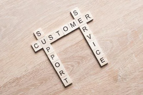 Conceptual media keywords on table with elements of game making crossword Stock Photos