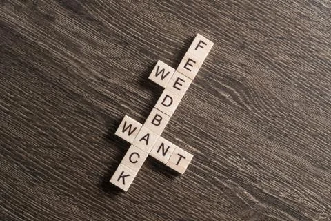 Conceptual media keywords on table with elements of game making crossword Stock Photos