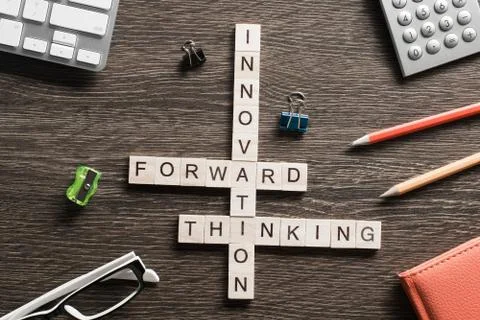 Conceptual media keywords on table with elements of game making crossword Stock Photos