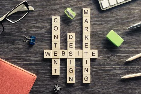 Conceptual media keywords on table with elements of game making Stock Photos