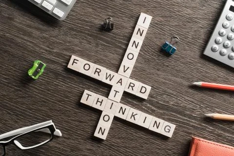 Conceptual media keywords on table with elements of game making crossword Stock Photos