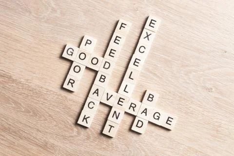 Conceptual media keywords on table with elements of game making crossword Foto stock