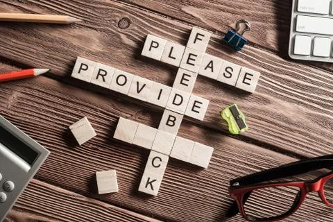 Conceptual media keywords on table with elements of game making crossword Stock Photos