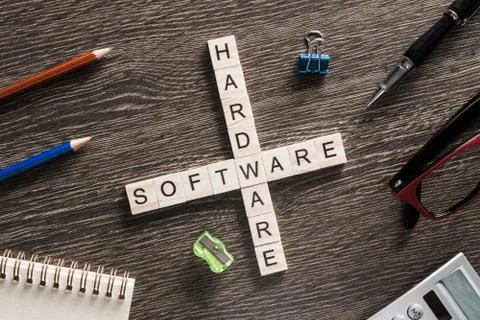 Conceptual media keywords on table with elements of game making crossword Foto stock