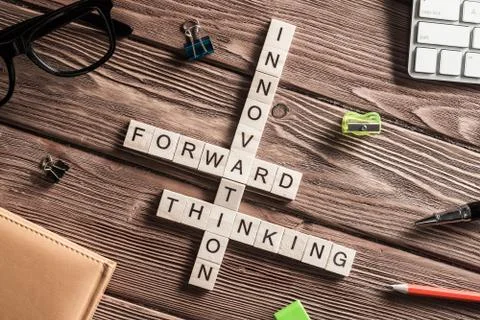 Conceptual media keywords on table with elements of game making crossword Stock Photos