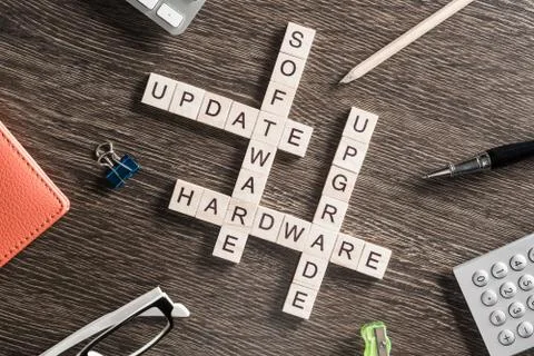 Conceptual media keywords on table with elements of game making crossword Stock Photos