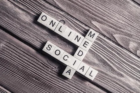 Conceptual media keywords on table with elements of game making Stock Photos