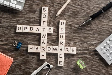 Conceptual media keywords on table with elements of game making crossword Stock Photos