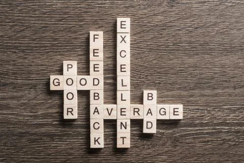 Conceptual media keywords on table with elements of game making crossword Stock Photos