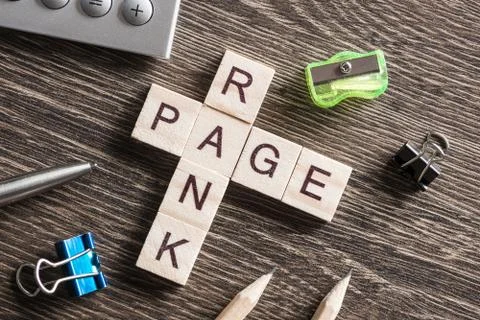 Conceptual media keywords on table with elements of game making crossword Stock Photos