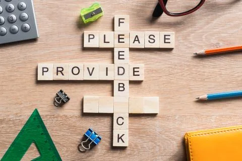 Conceptual media keywords on table with elements of game making crossword Stock Photos