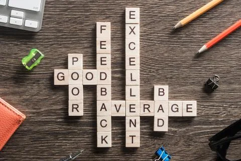 Conceptual media keywords on table with elements of game making crossword Stock Photos
