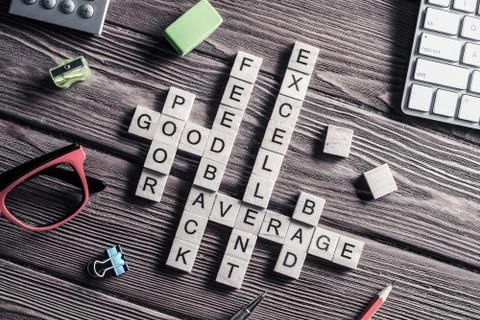 Conceptual media keywords on table with elements of game making Stock Photos