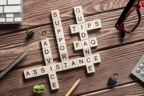 Conceptual media keywords on table with elements of game making crossword Stock Photos