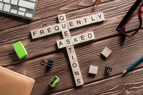 Conceptual media keywords on table with elements of game making crossword Foto stock
