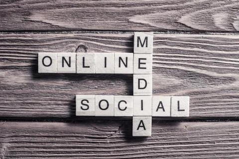 Conceptual media keywords on table with elements of game making Stock Photos