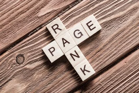 Conceptual media keywords on table with elements of game making crossword Stock Photos