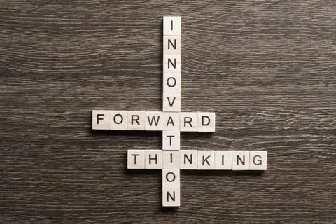 Conceptual media keywords on table with elements of game making crossword Foto stock