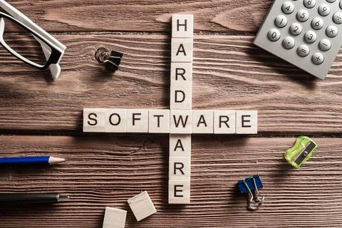 Conceptual media keywords on table with elements of game making crossword Foto stock