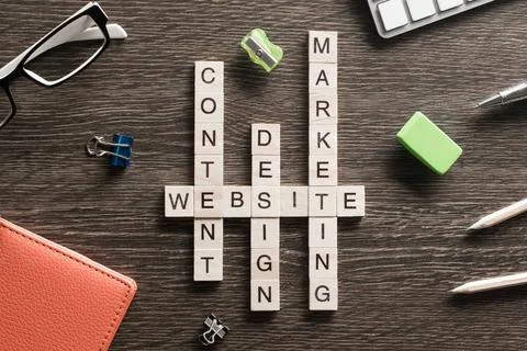 Conceptual media keywords on table with elements of game making crossword ... Stock Photos