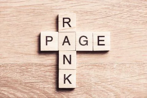 Conceptual media keywords on table with elements of game making crossword Stock Photos