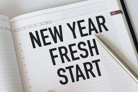 Conceptual, notebook on a white table. open diary and pen with new year...f.. Stock Photos