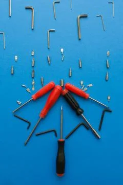 Conceptual set of tools on blue background. It looks like raining and umbrell Stock Photos