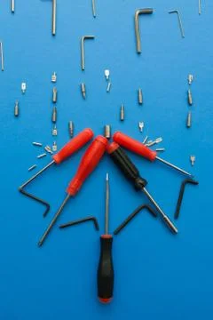 Conceptual set of tools on blue background. It looks like raining and umbrell Stock Photos