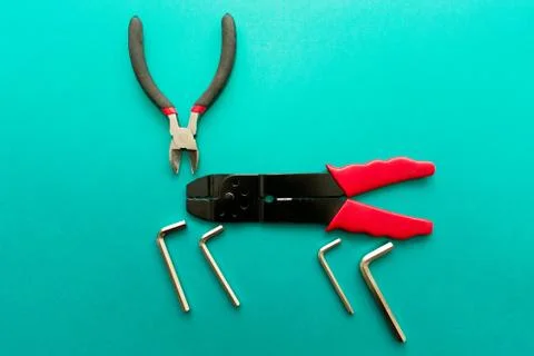 Conceptual set of tools on green background. It looks like a deer. Working ha Stock Photos