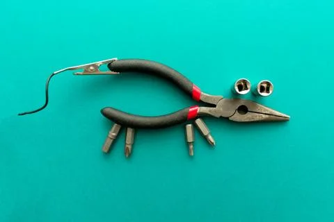 Conceptual set of tools on green background. It looks like a mouse. Working h Stock Photos