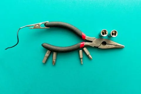 Conceptual set of tools on green background. It looks like a mouse. Working h Stock Photos