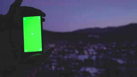 Conceptual shot hands of young man holding smartphone green screen chroma key Stock Footage 150584819