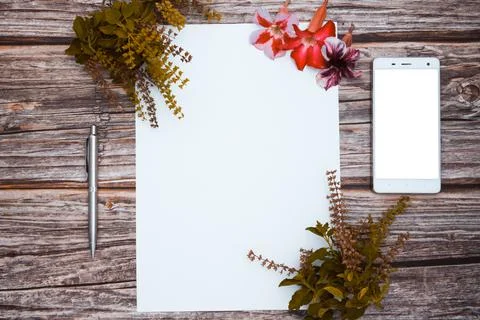 Conceptual space for text, which consists of blank paper, azalea, basil flowe Stock Photos