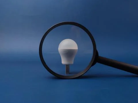 A conceptual studio shot featuring a small white USB LED light bulb standin.. Фото