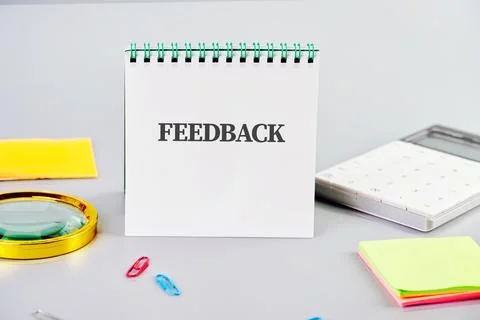 Conceptual time for feedback symbol. Copy space. FEEDBACK word written on a b Stock Photos