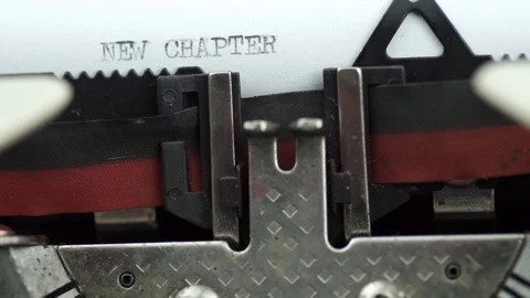 Conceptual, typing NEW CHAPTER word using old typewriter Stock Footage 109423190
