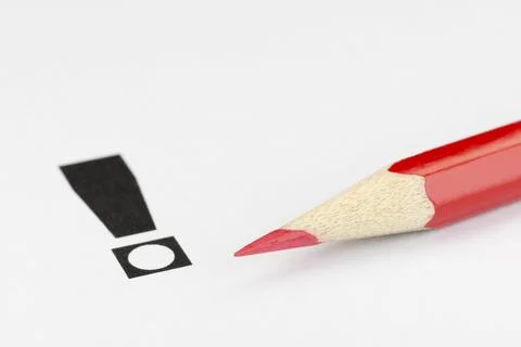 Conceptual visualization of an exclamation point and red pencil as a convinced Stock Photos