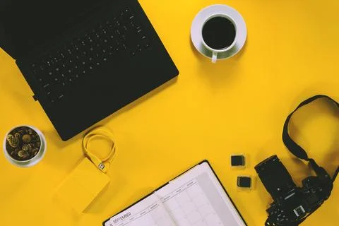 Conceptual workspace, Laptop computer and coffee cup, note book with Camera.. Stock Photos