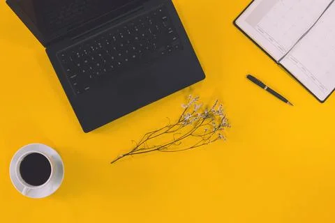 Conceptual workspace; Laptop computer and coffee cup; note book with White .. Stock Photos