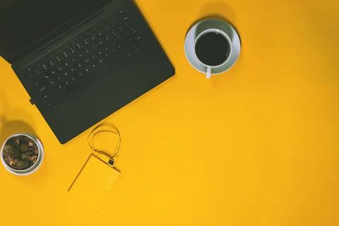 Conceptual workspace, Laptop computer and coffee cup, with Camera and Cactu.. Stock Photos