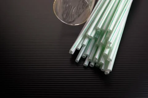 Conceptual of world issue on single use plastic against reusable steel straw. Stock Photos