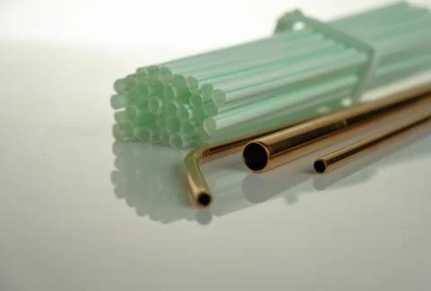 Conceptual of world issue on single use plastic against reusable steel straw. Stock Photos